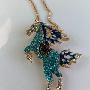 Cute NWOT rhinestone bejeweled standing teal horse on gold tone chain